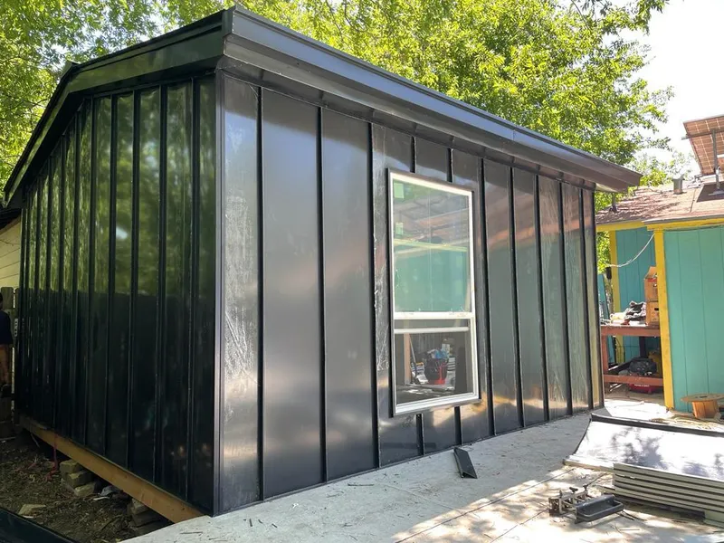 Black standing seam metal wall panels for Roof Inspection in Aldine