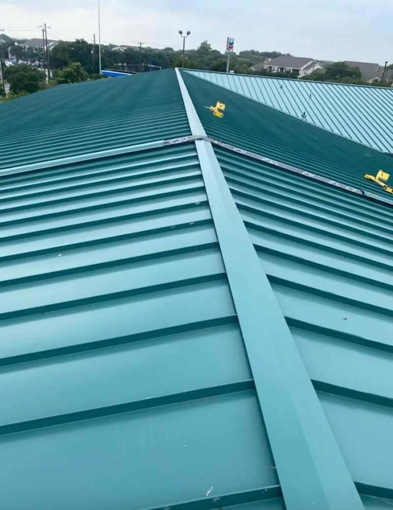 Green commercial metal roof ridge and valley for Metal Roof Repair in Aldine