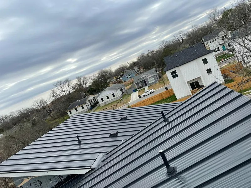 Standing seam metal roof panels with vents for Skylight Repair in Aldine